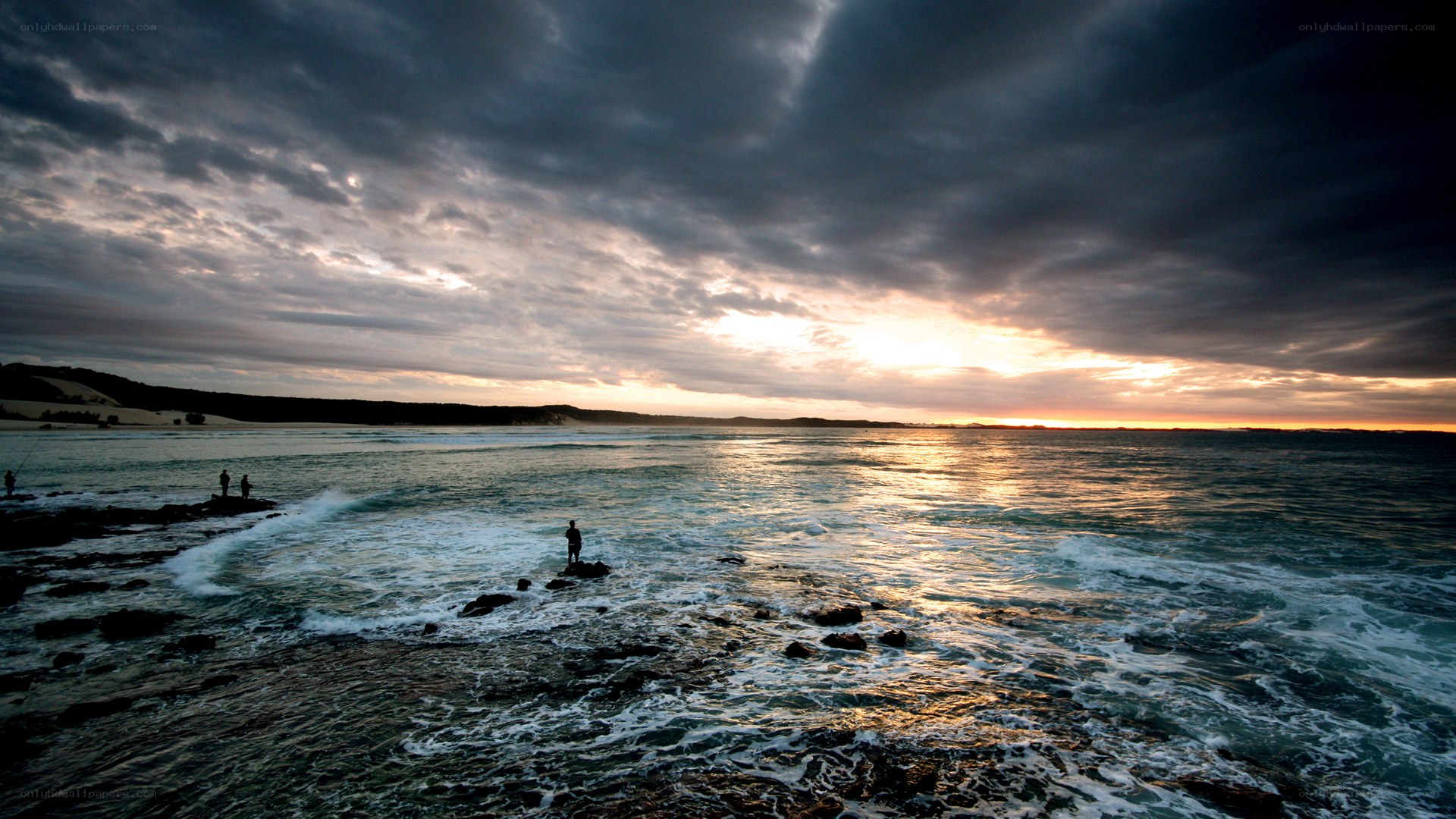 Sunset over rocky coastline