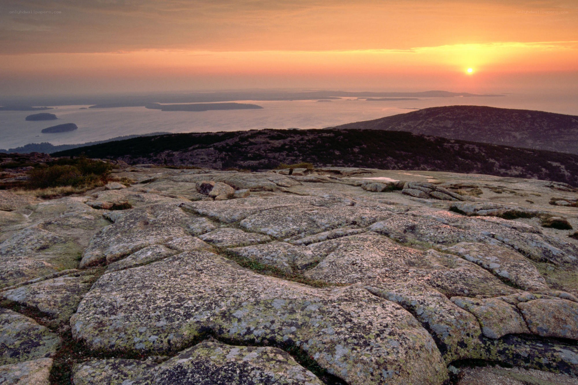 Sunset over rocky coastline