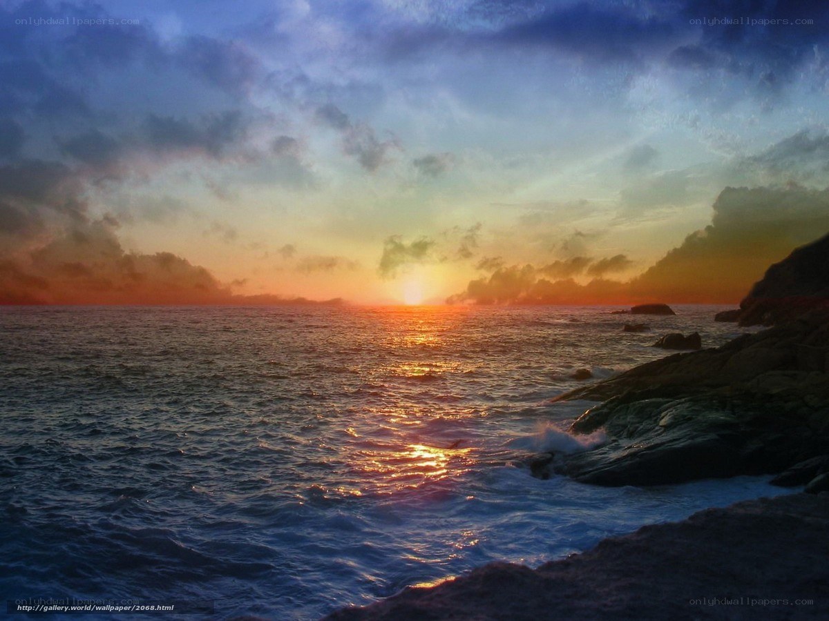 Sunset over rocky coastline
