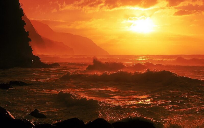 Sunset over rocky coastline