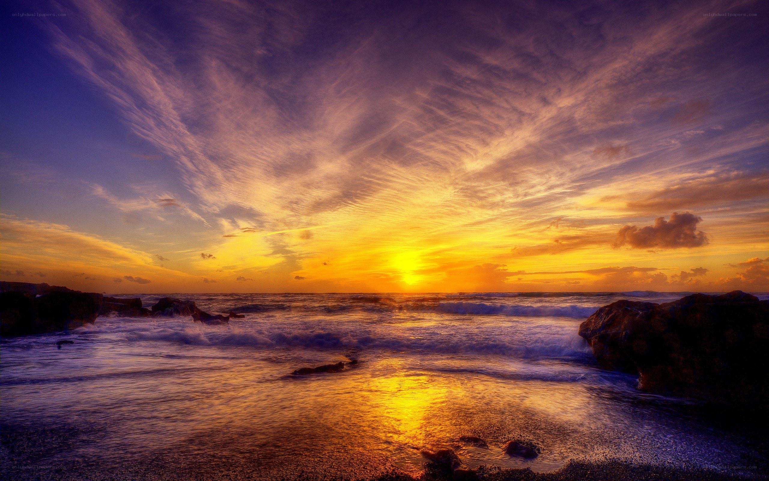 Sunset over rocky coastline