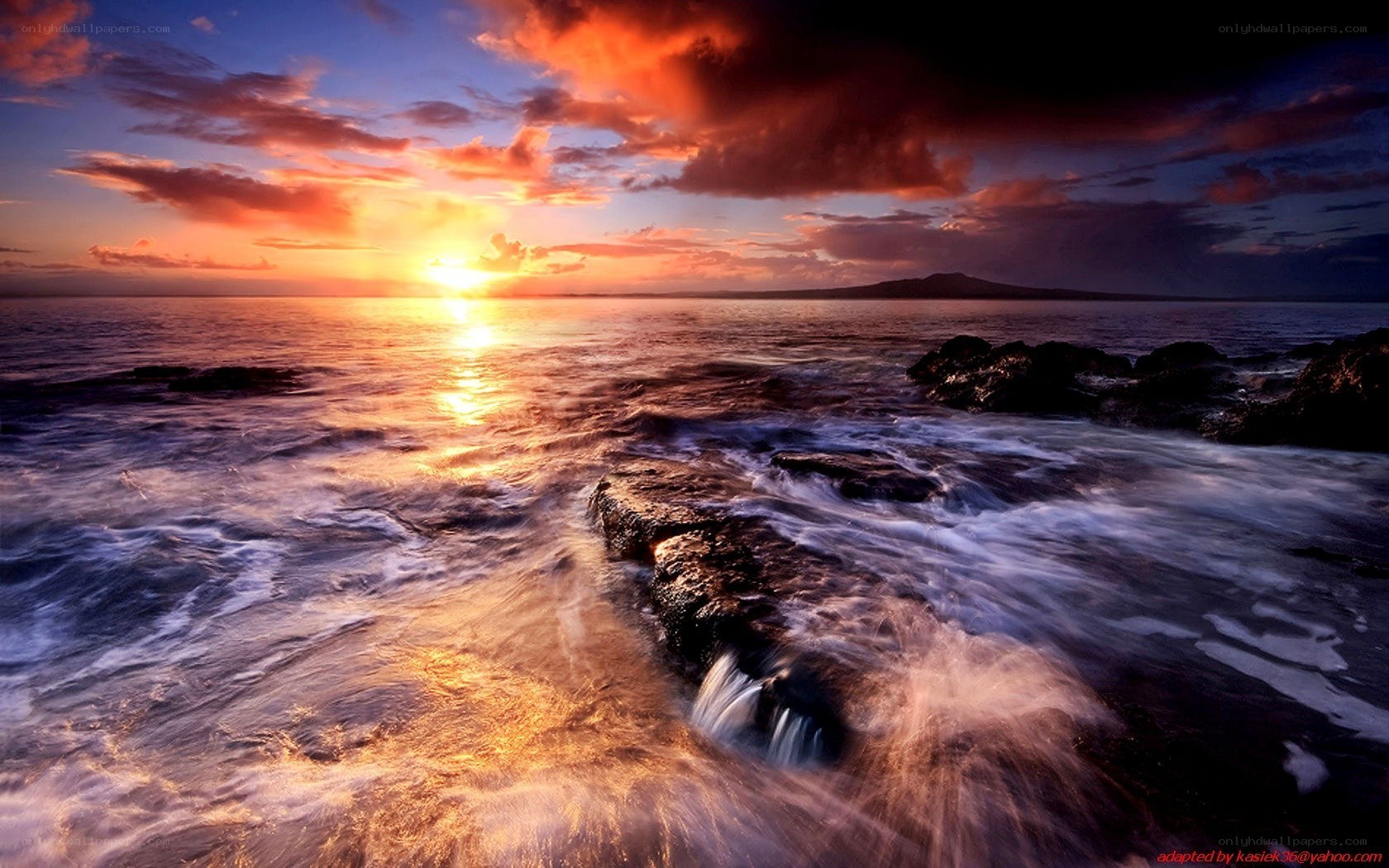 Sunset over rocky coastline