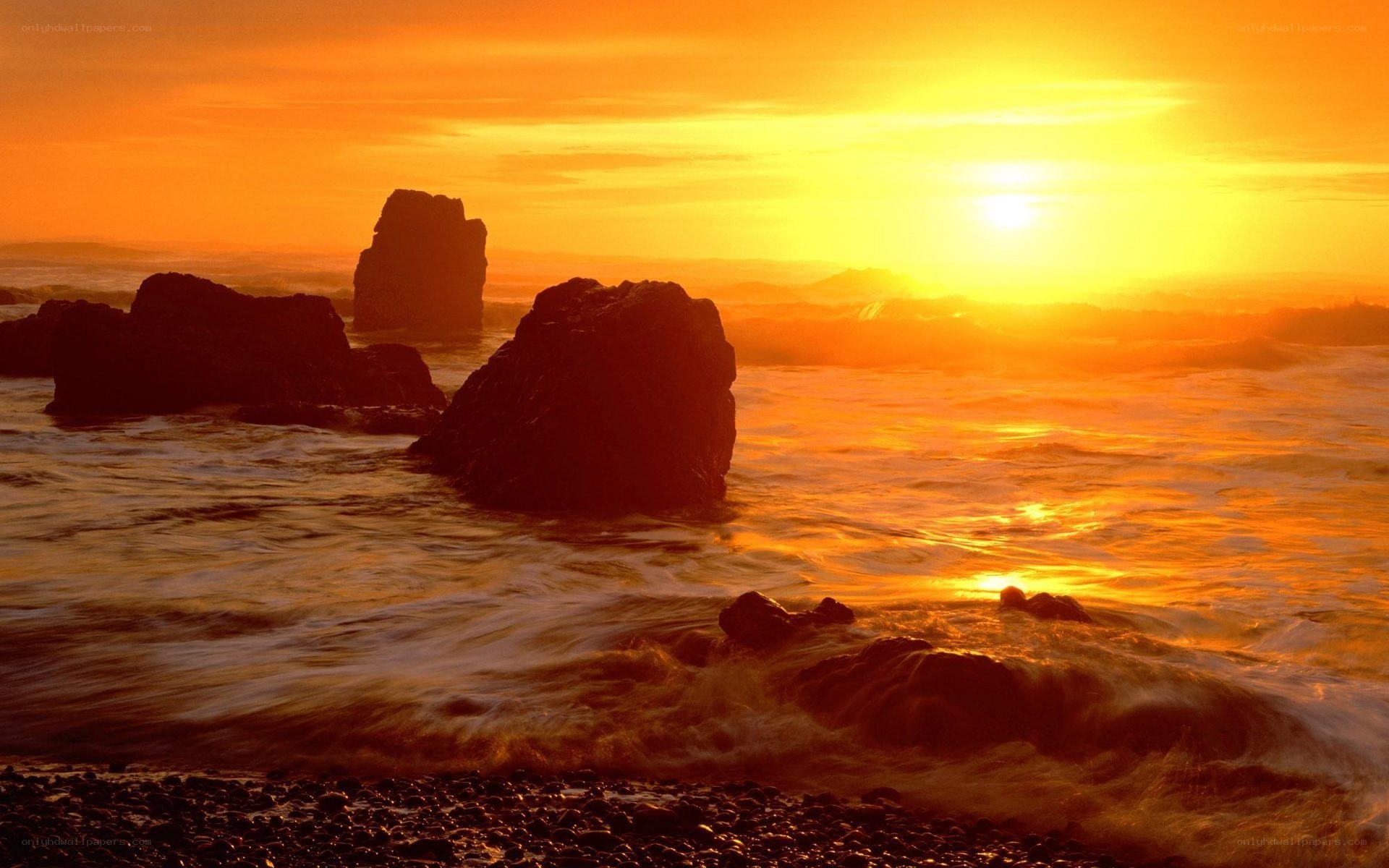 Sunset over rocky coastline