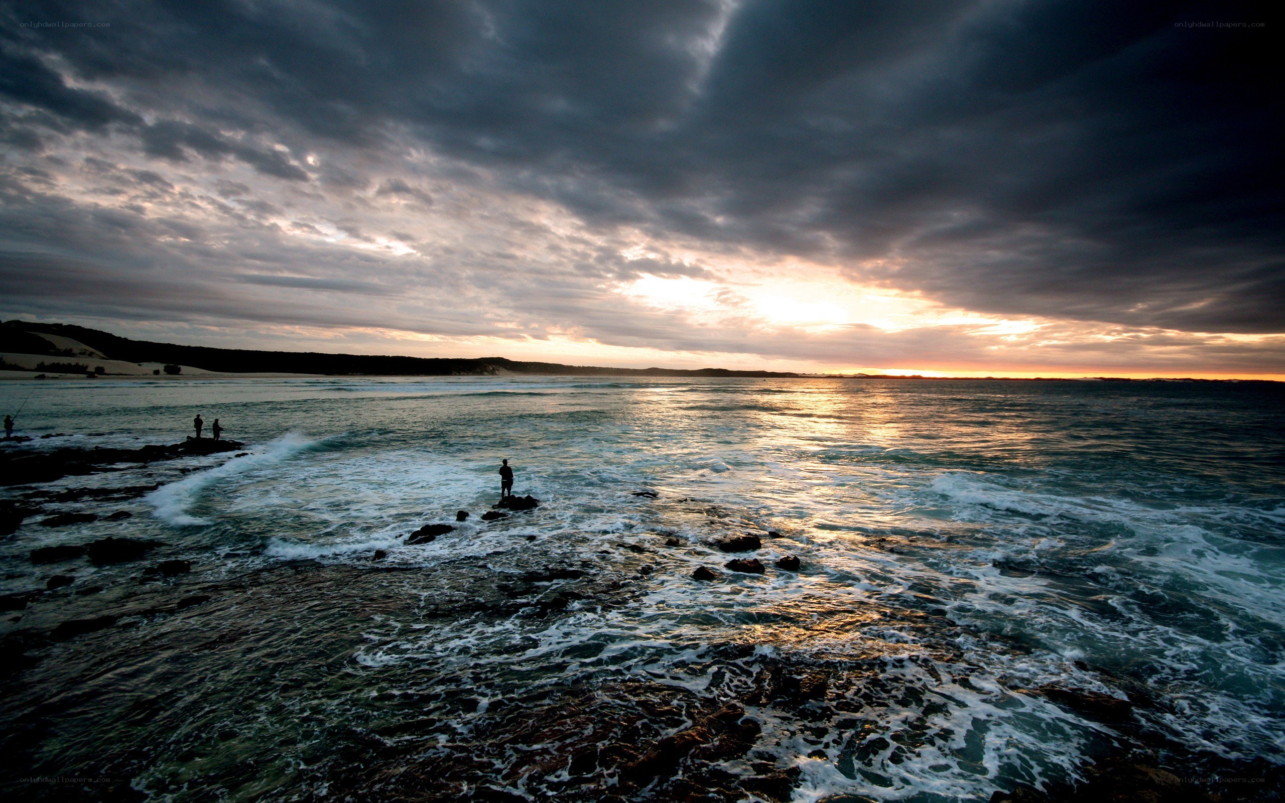 Sunset over rocky coastline