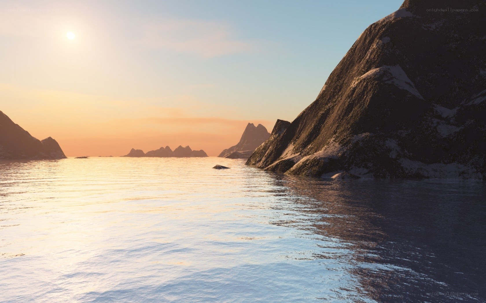 sunset over rocky coastline