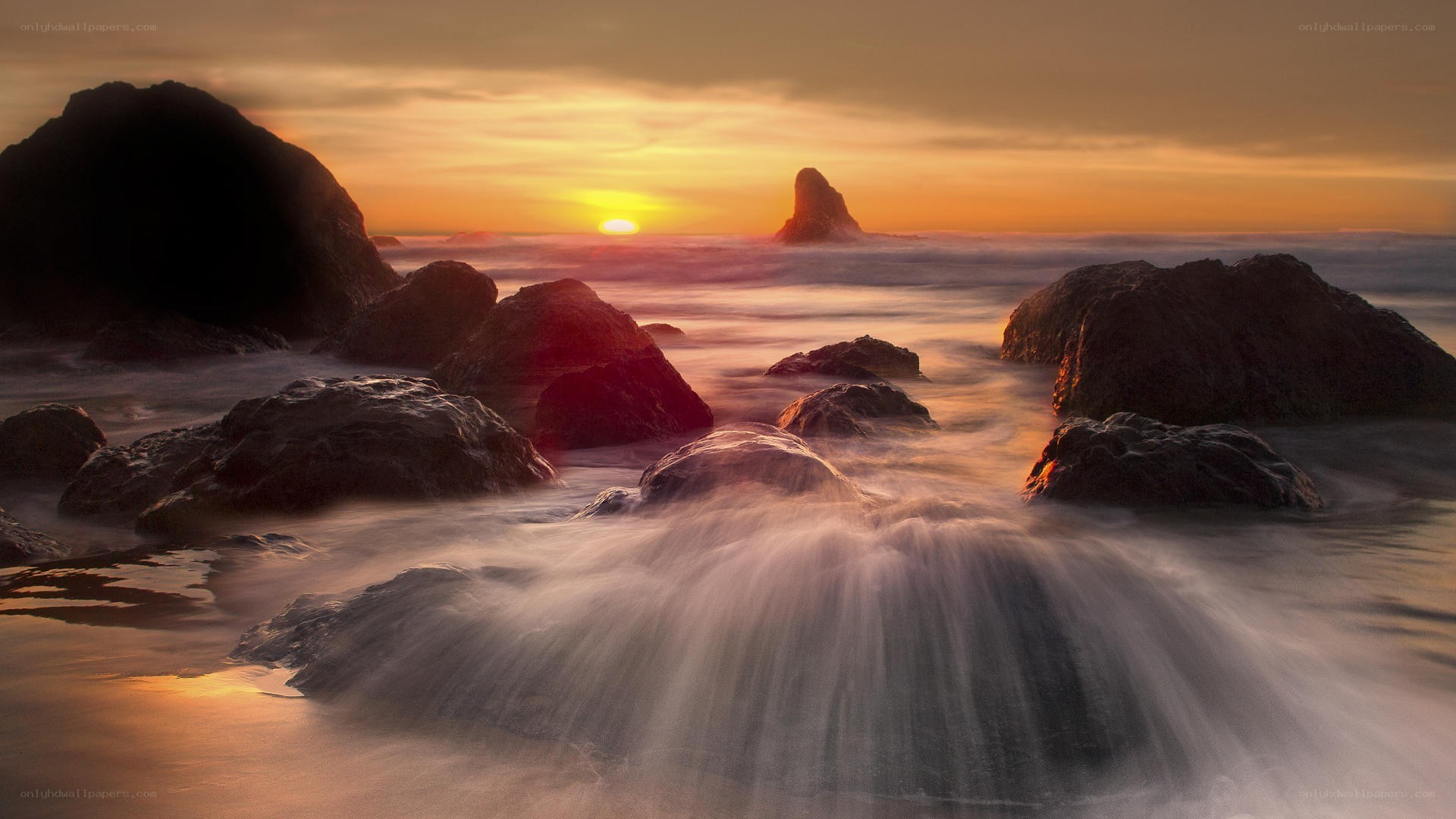 Sunset over rocky coastline