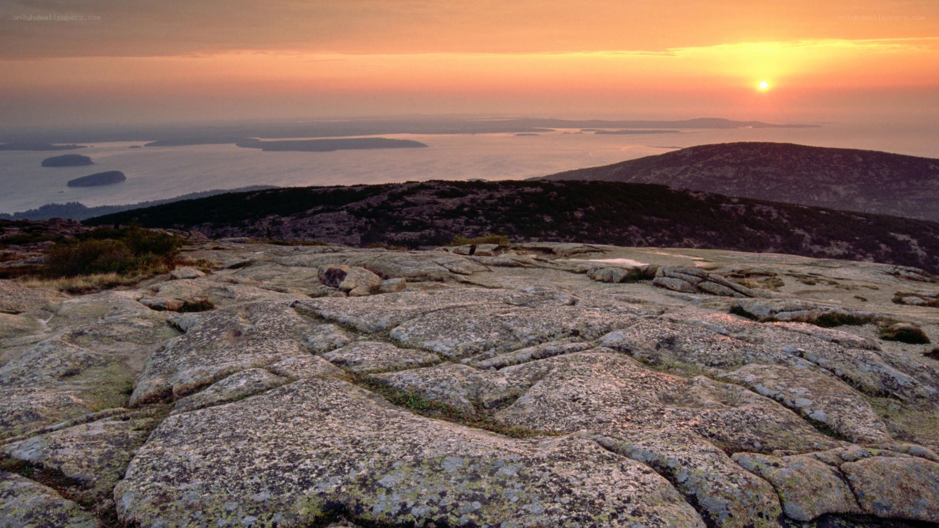 Sunset over rocky coastline