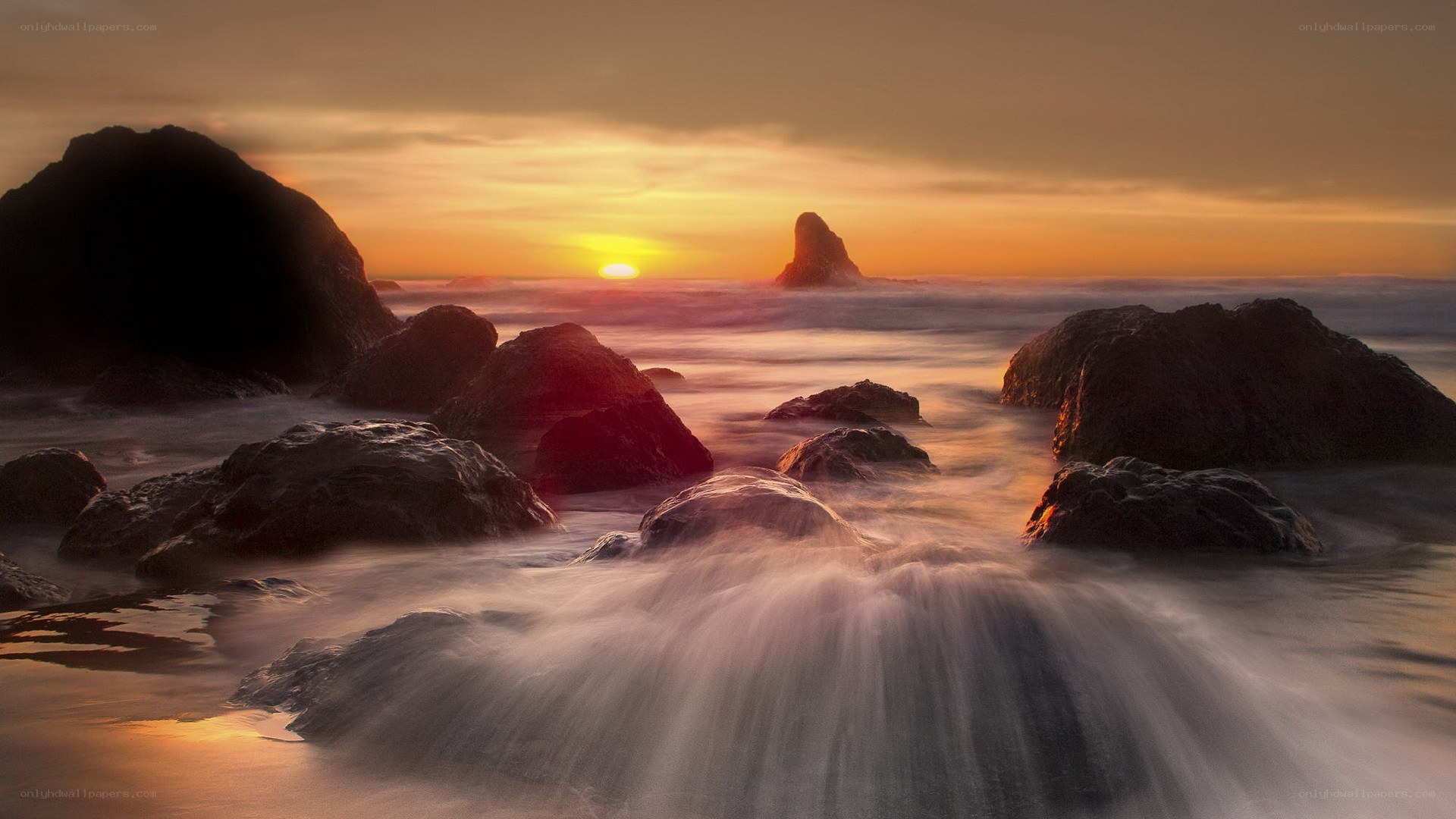 Sunset over rocky coastline