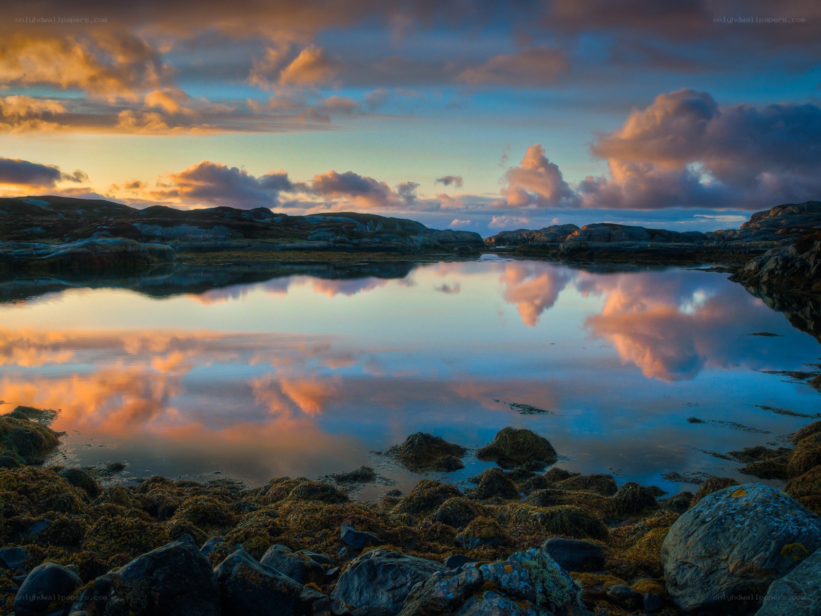 Sunset over rocky coastline