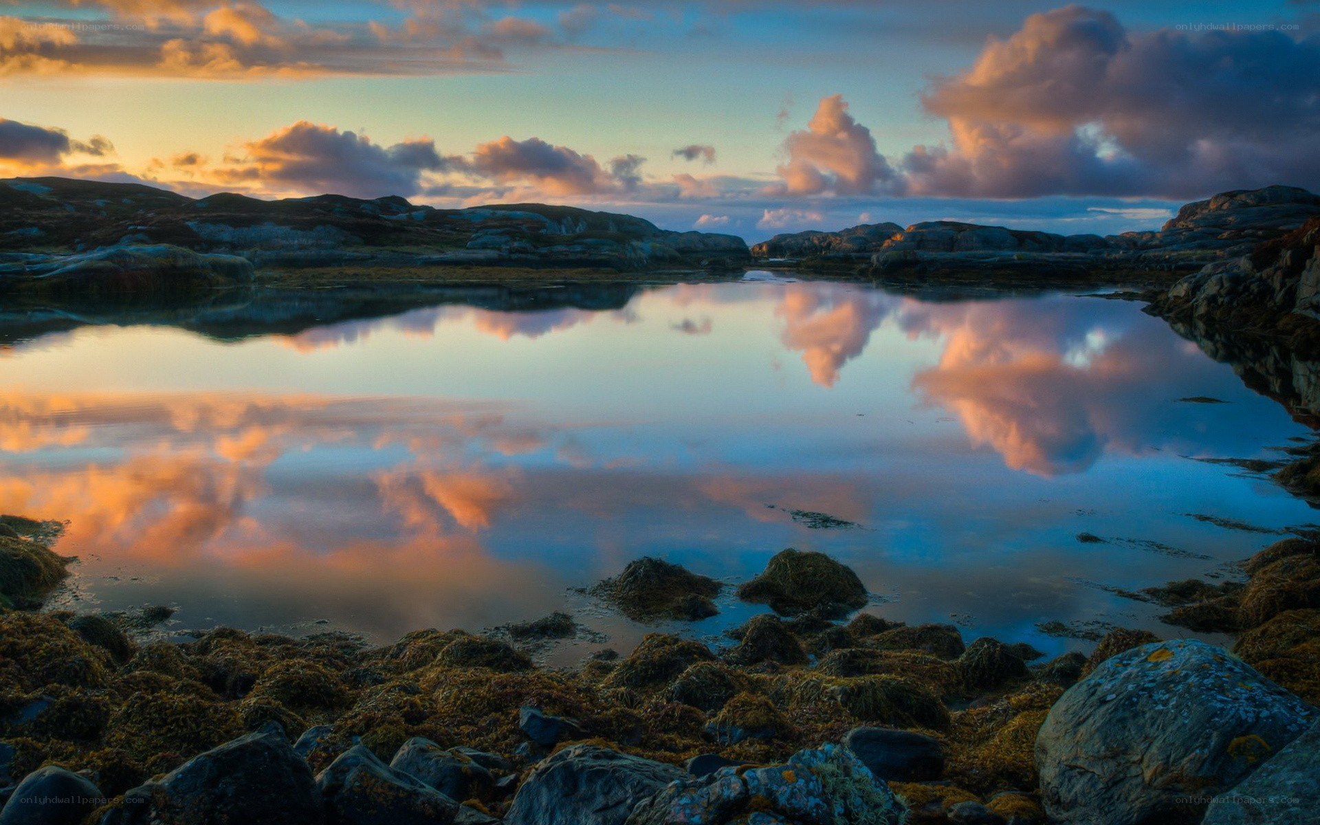 Sunset over rocky coastline