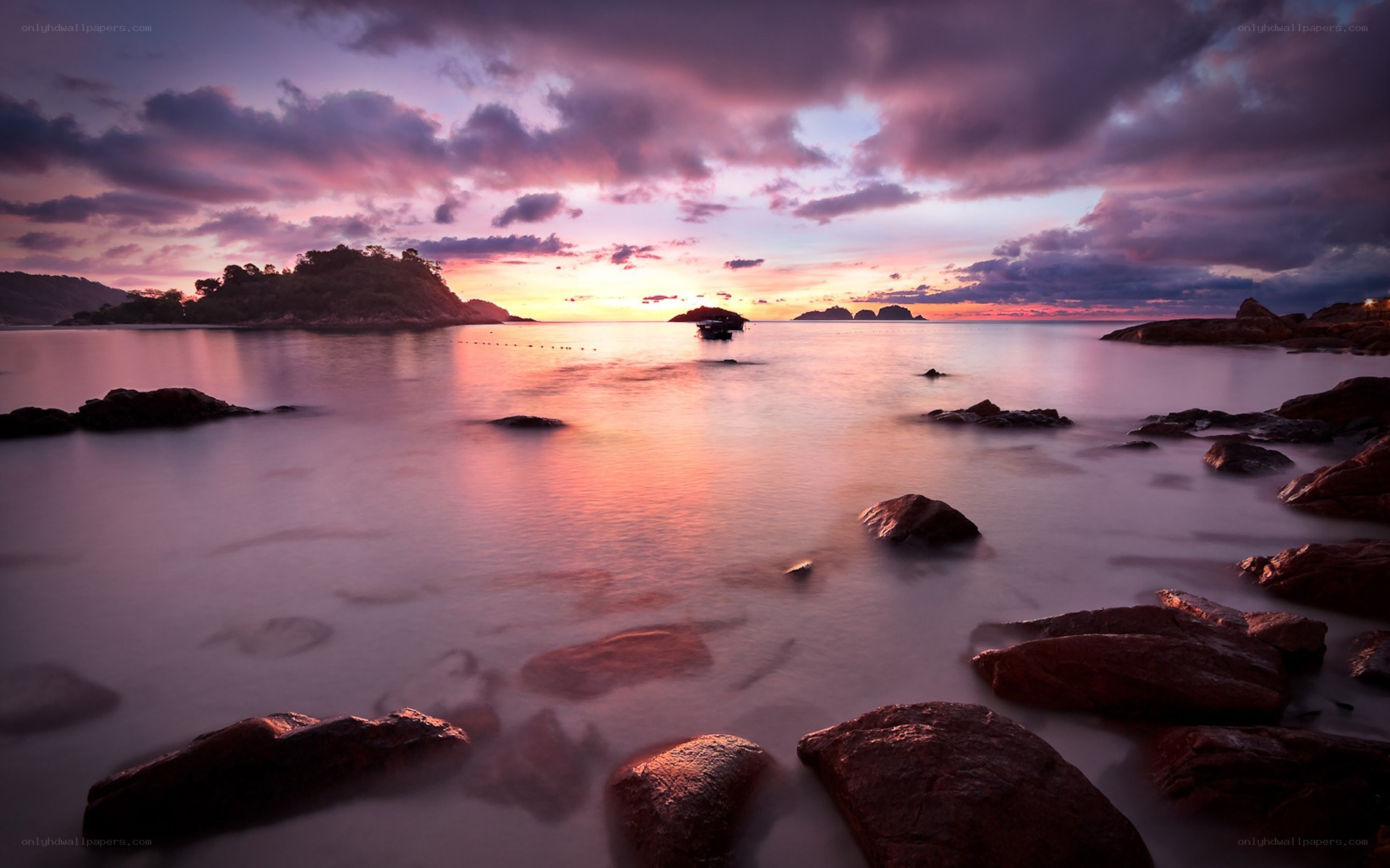 Sunset over rocky coastline