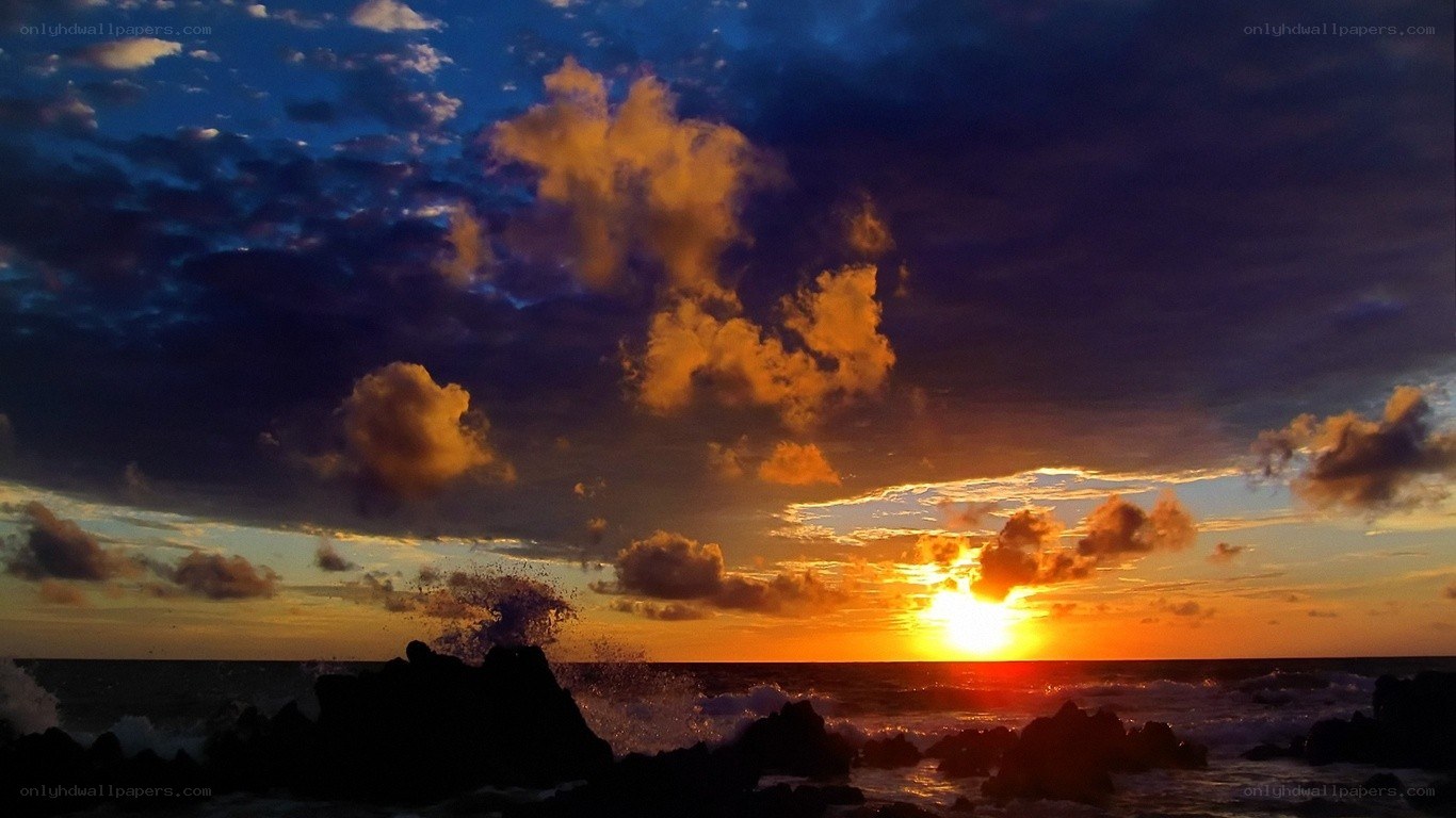 Sunset over rocky coastline