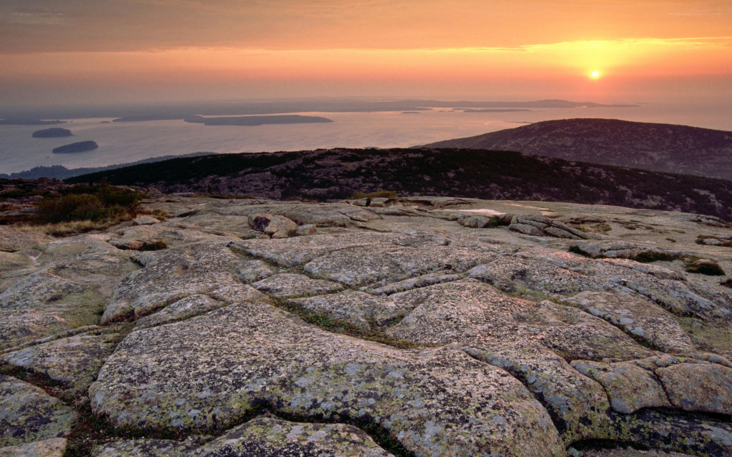 Sunset over rocky coastline