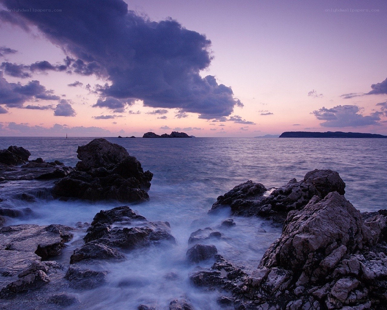 Sunset over rocky coastline