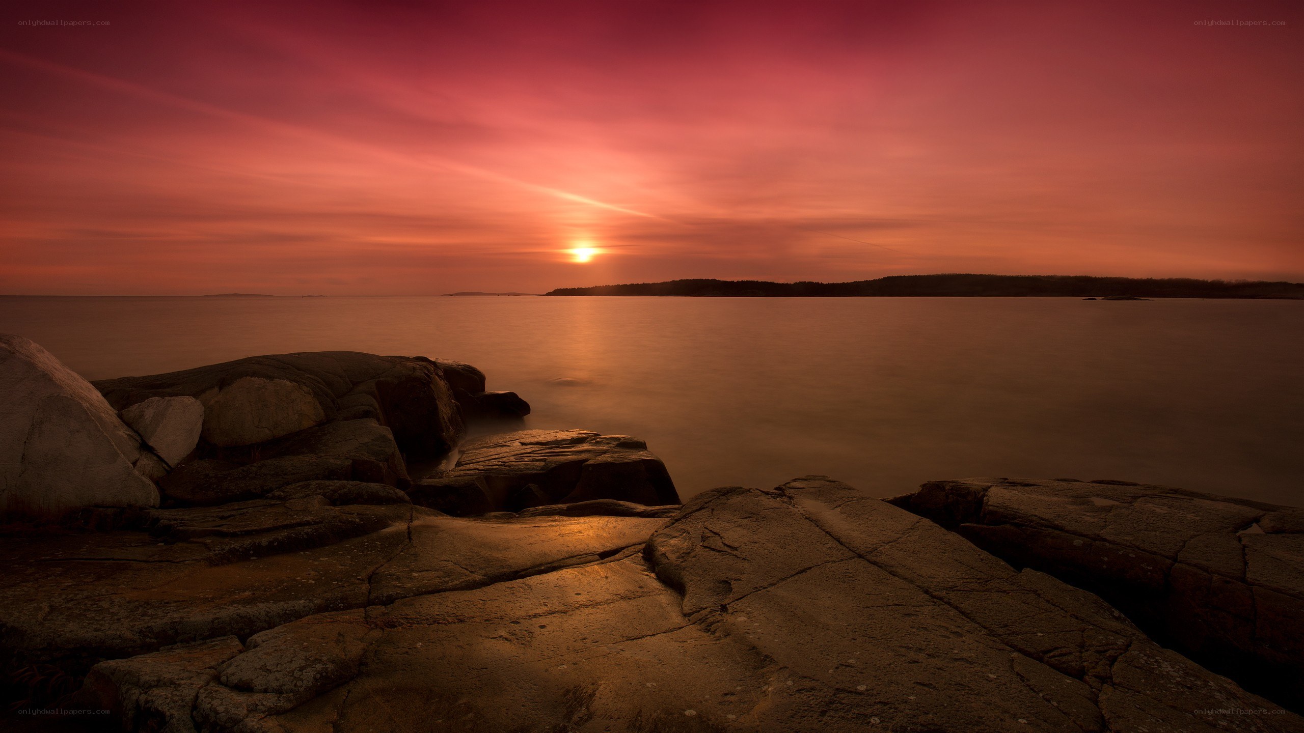Sunset over rocky coastline