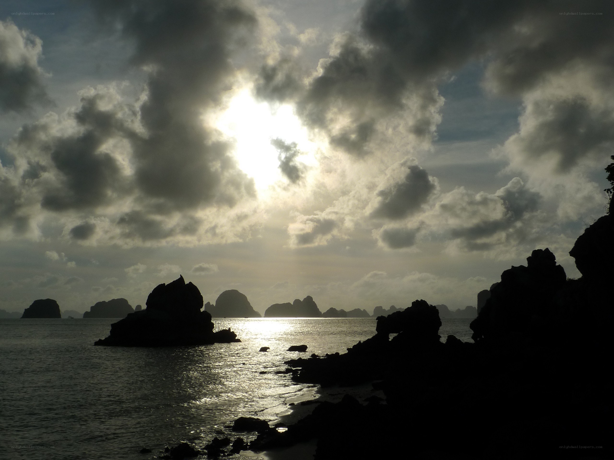 Sunset over rocky coastline