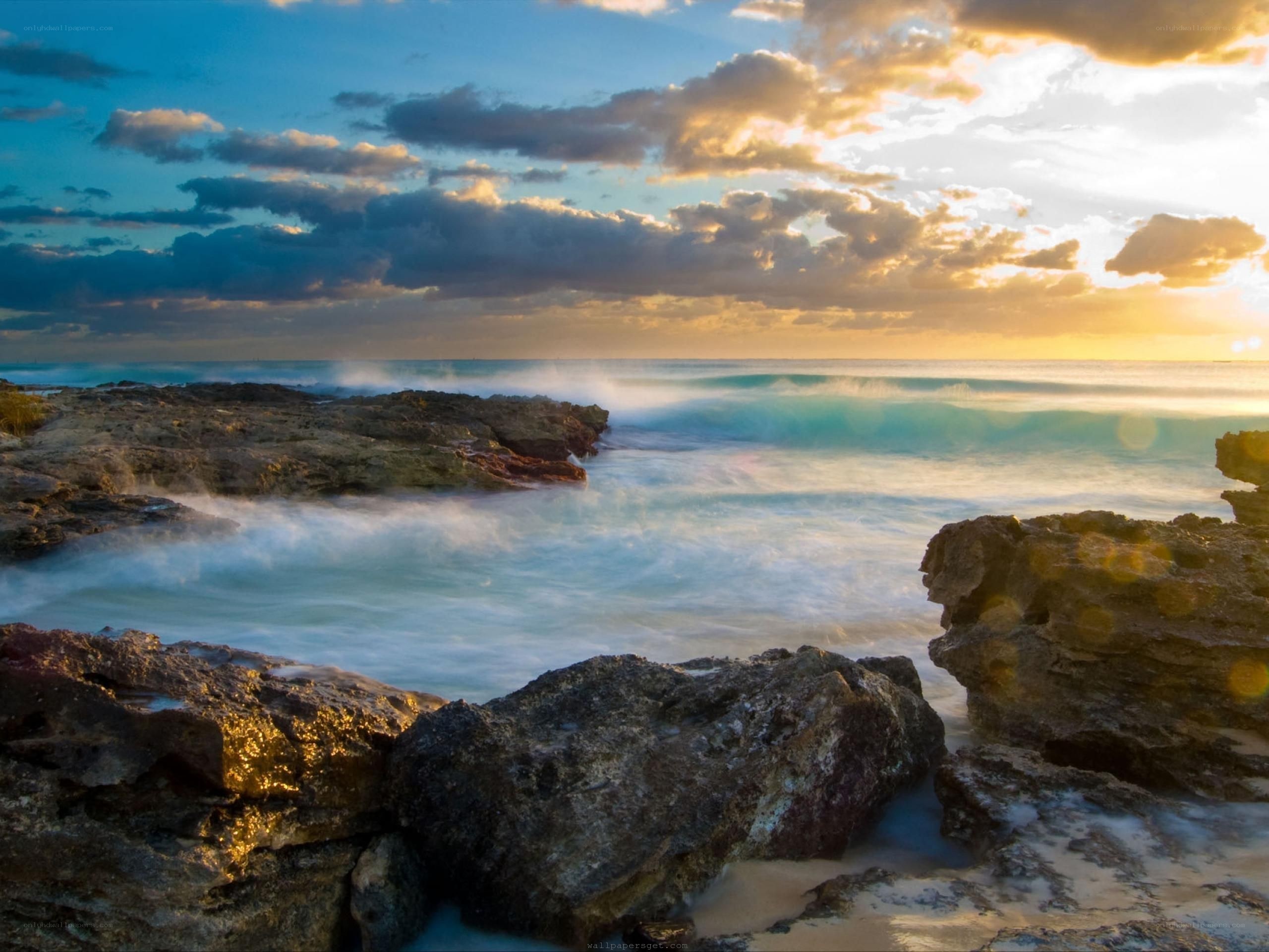 Sunset over rocky coastline