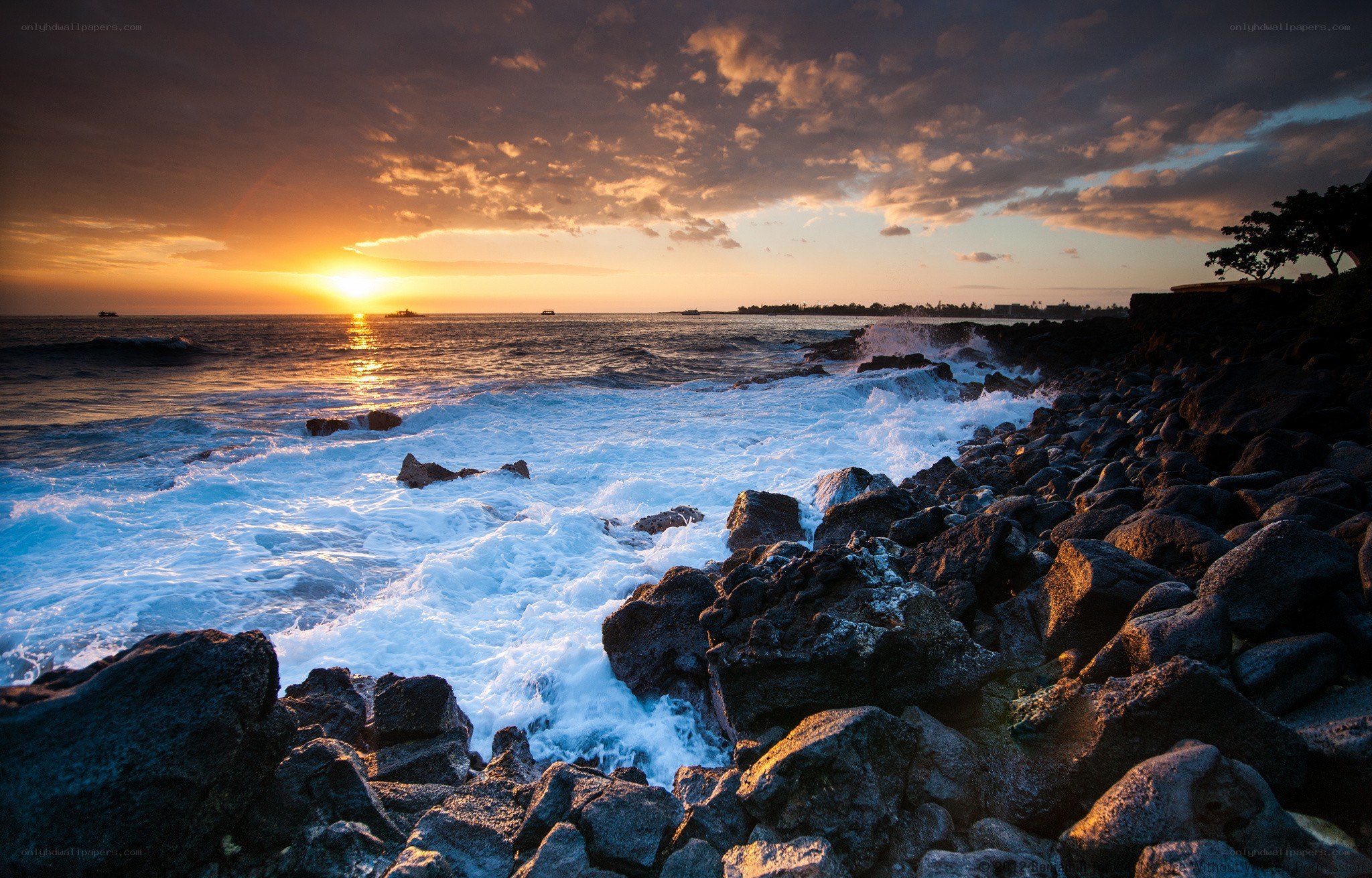 Sunset over rocky coastline