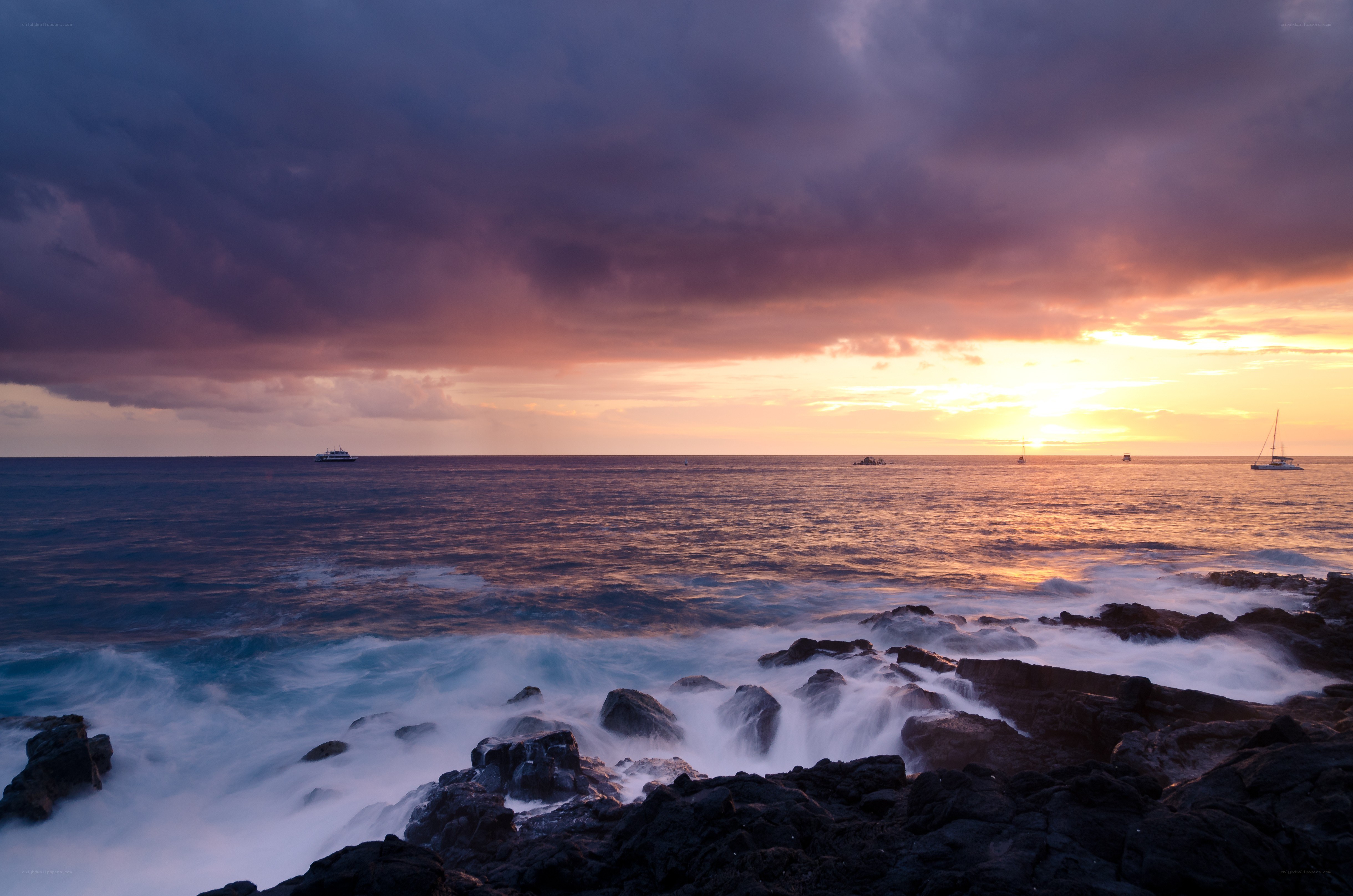 Sunset over rocky coastline