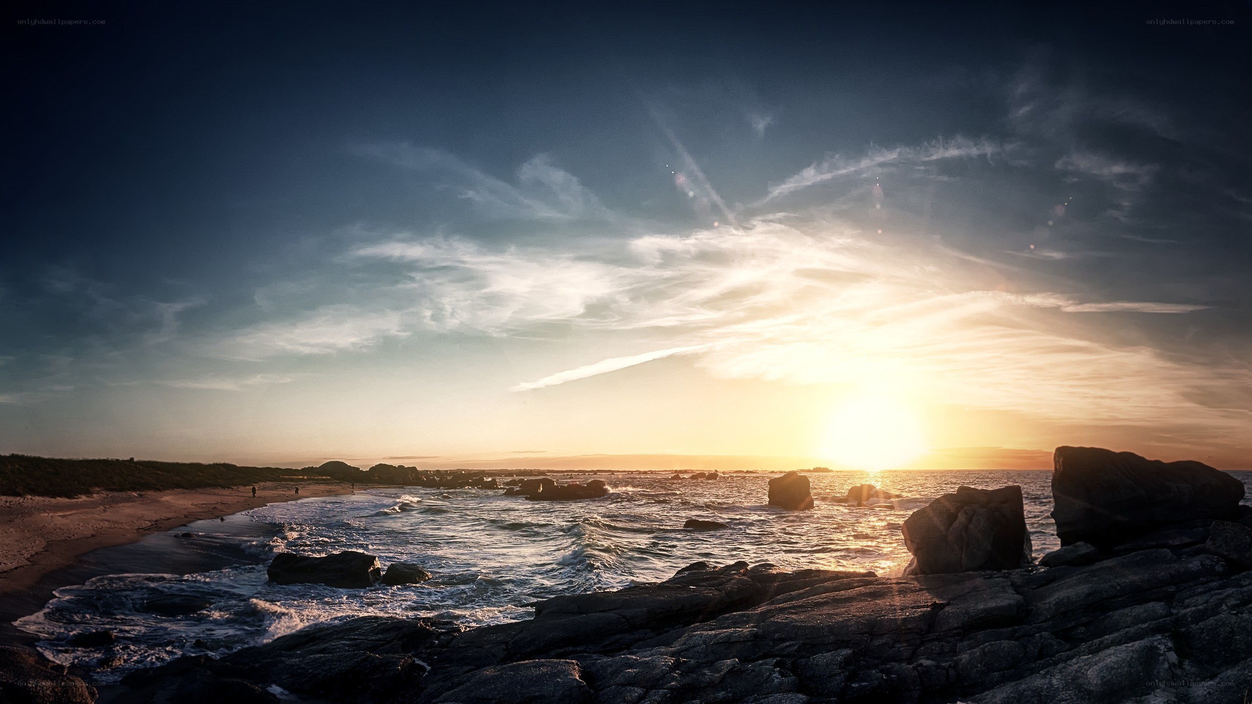 Sunset over rocky coastline