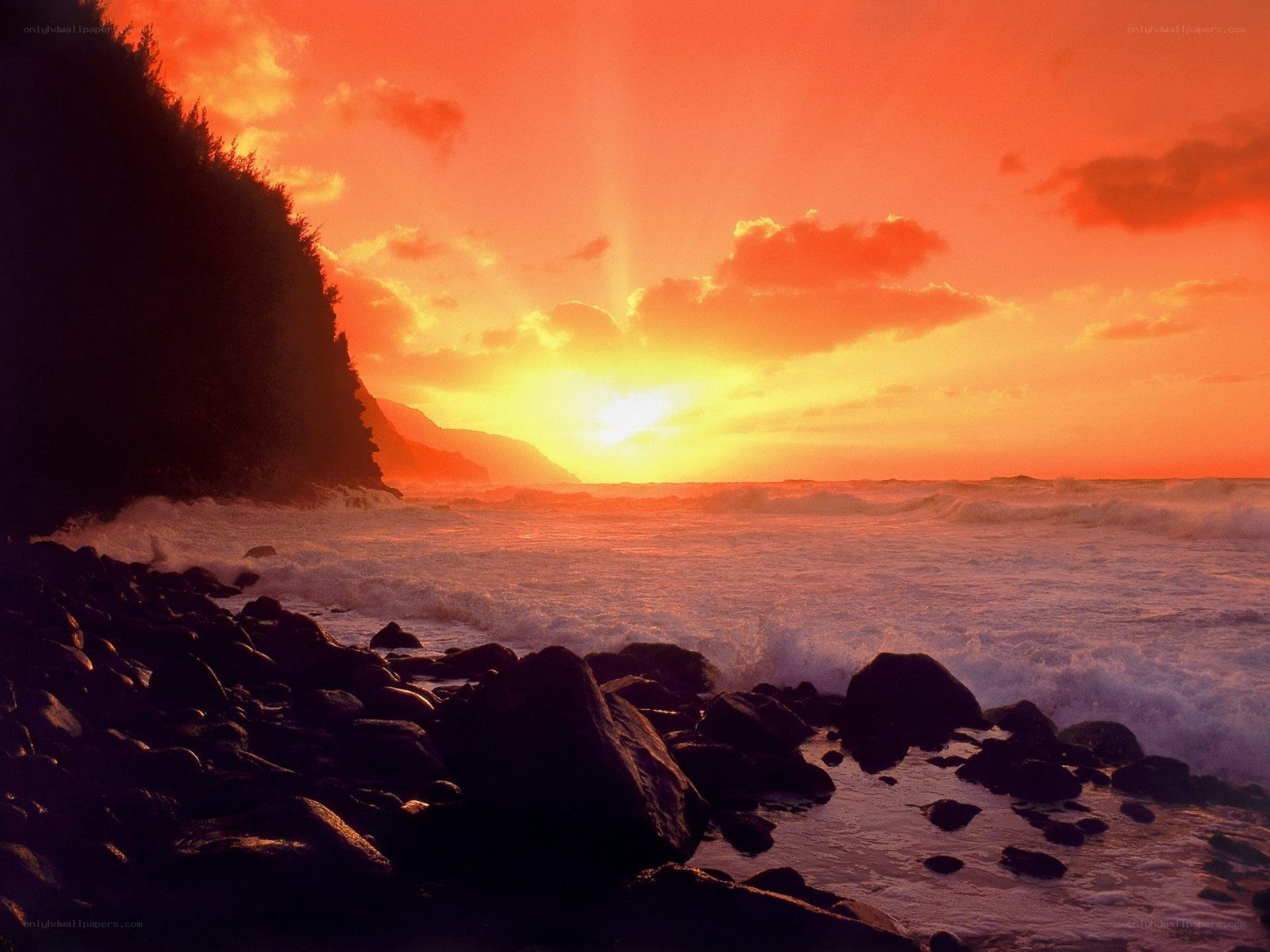 Sunset over rocky coastline