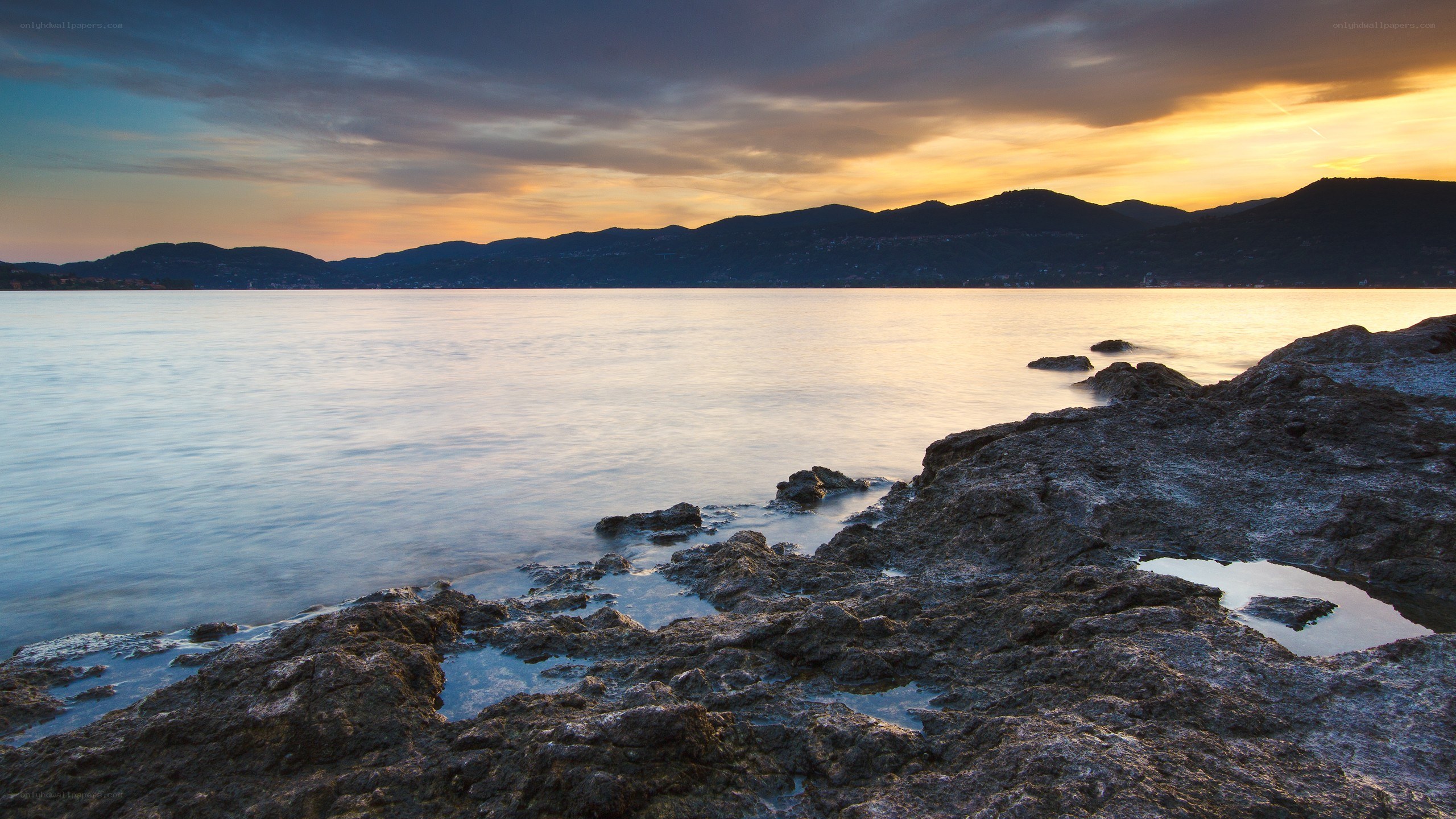 Sunset over rocky coastline