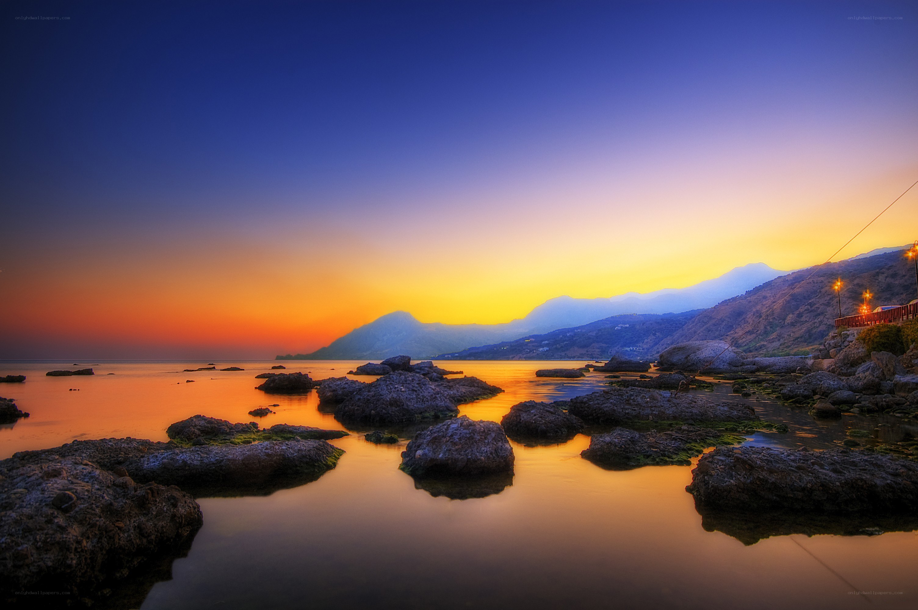 Sunset over rocky coastline