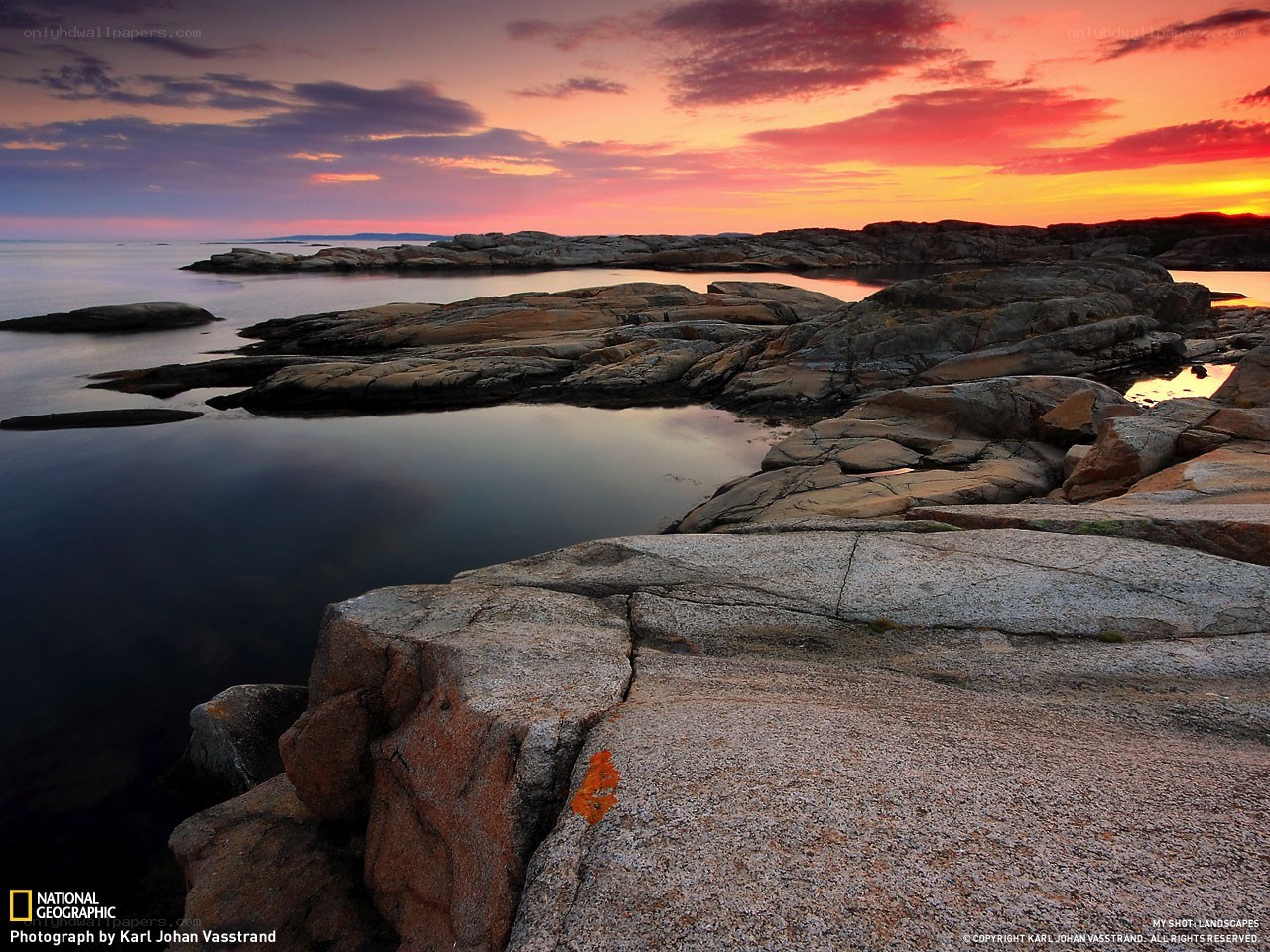 Sunset over rocky coastline