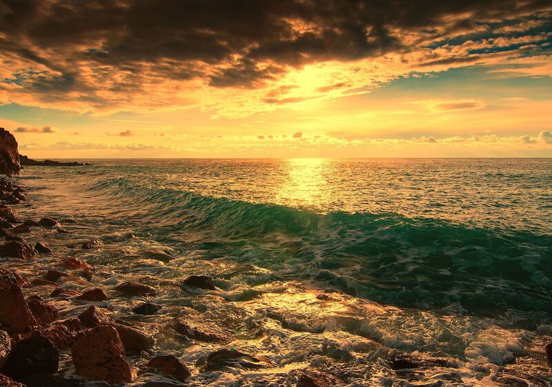 Sunset over rocky coastline
