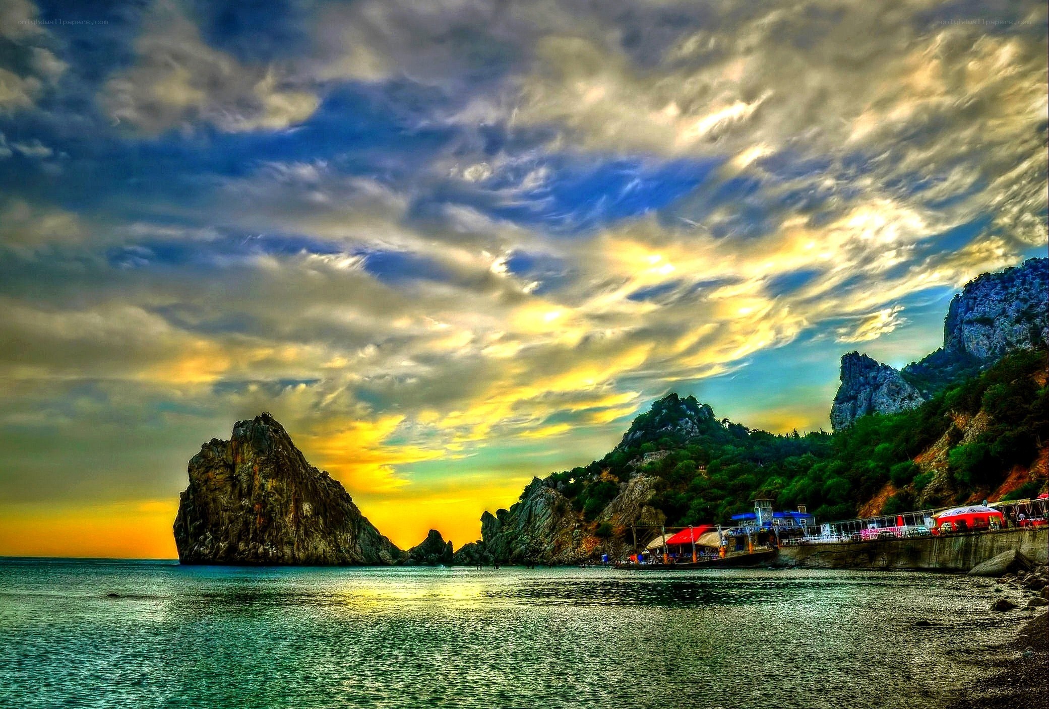 Sunset over rocky coastline