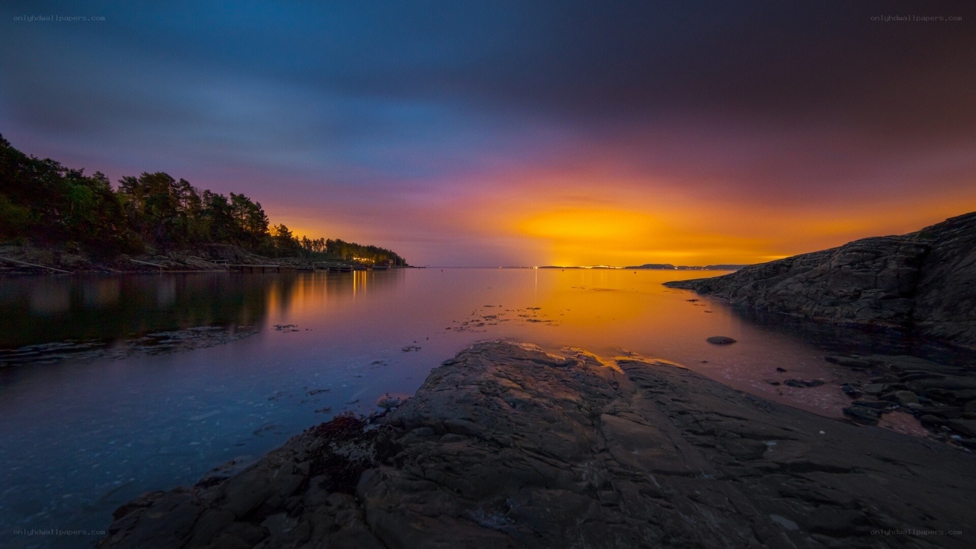 Sunset over rocky coastline