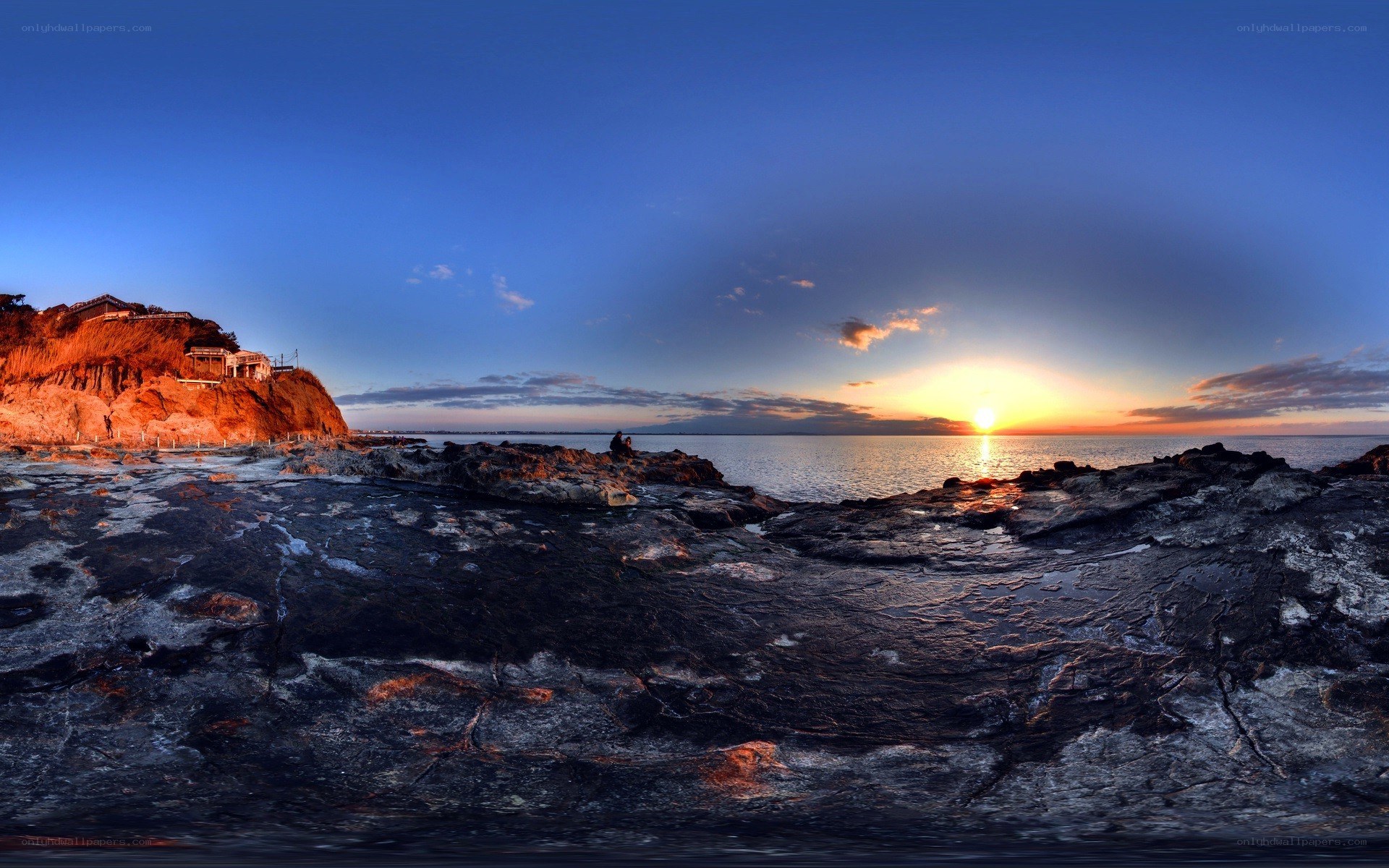 Sunset over rocky coastline