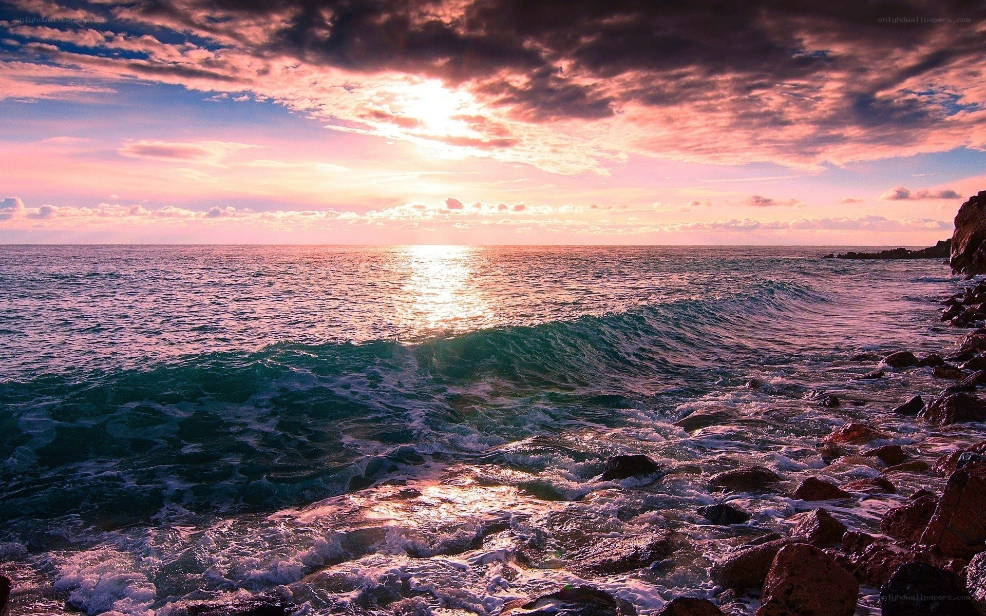 Sunset over rocky coastline