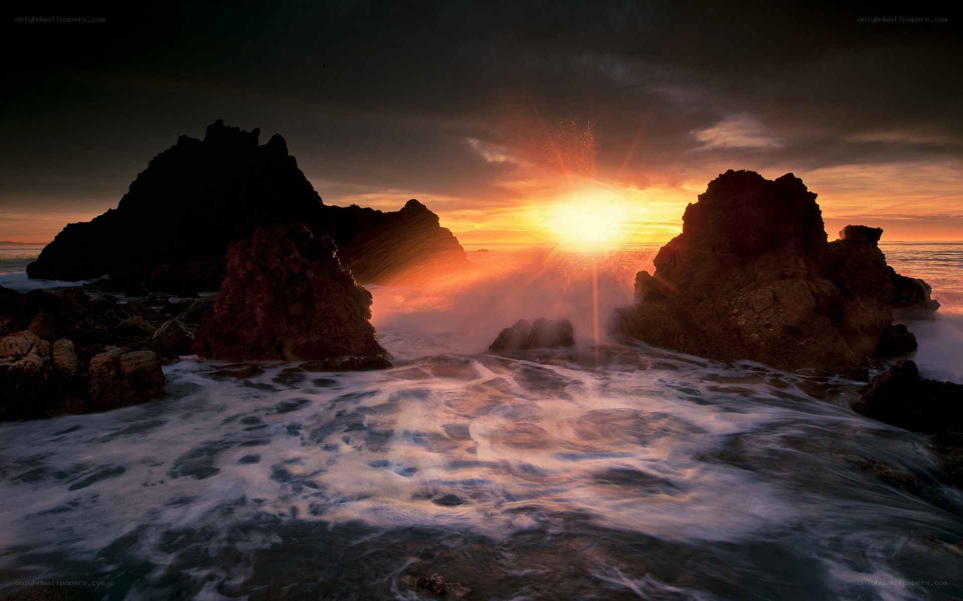 Sunset over rocky coastline