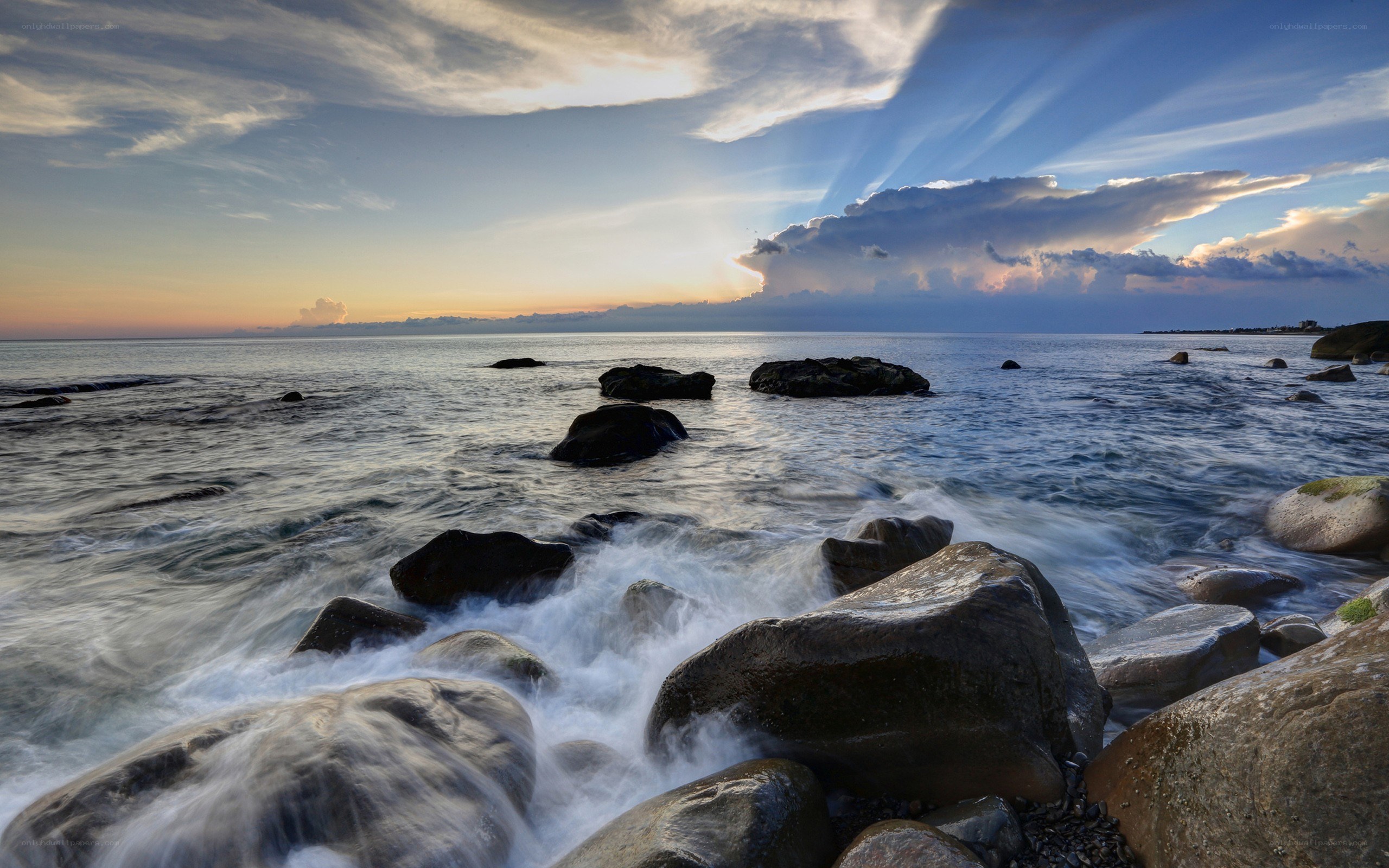 Sunset over rocky coastline