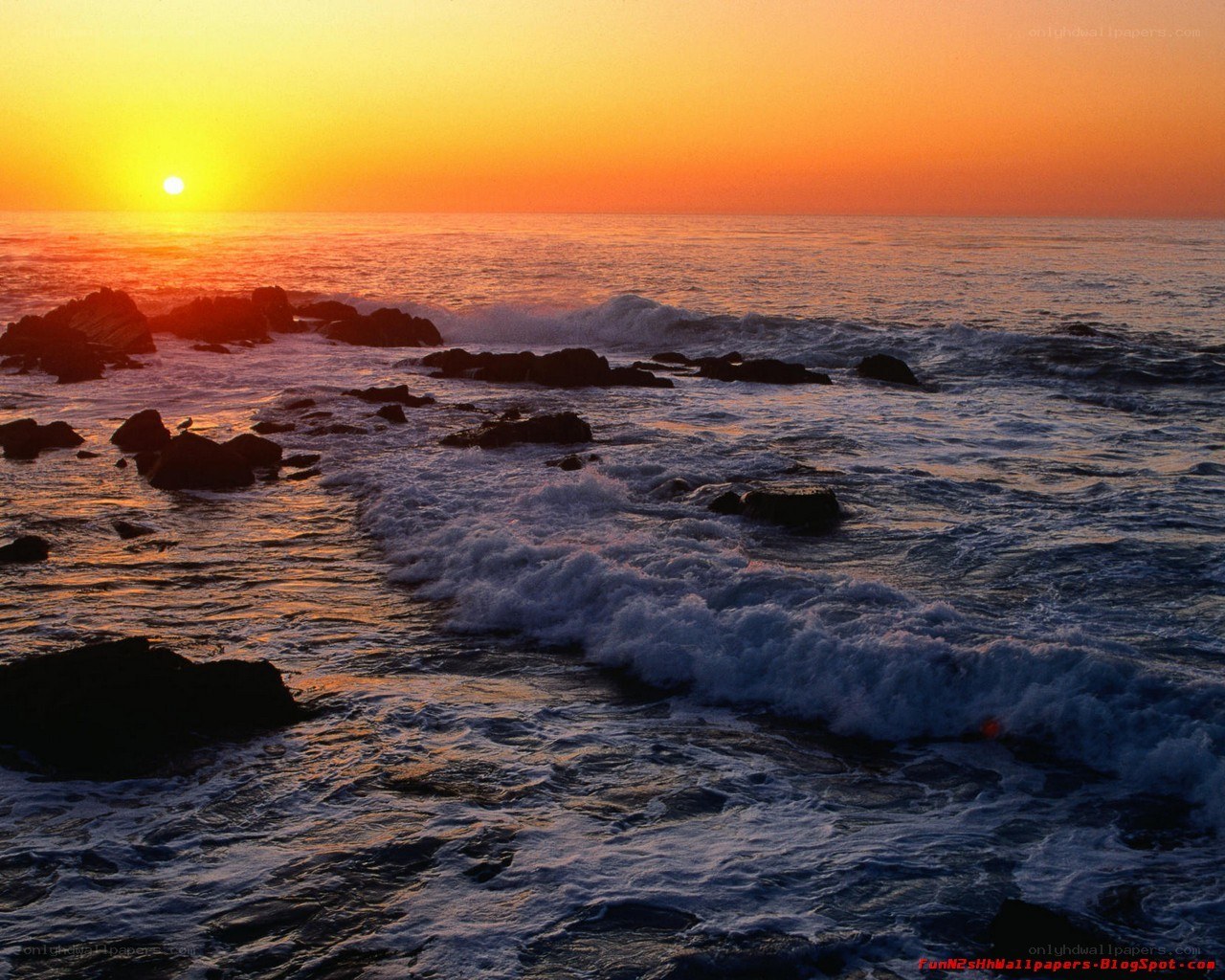 Sunset over rocky coastline