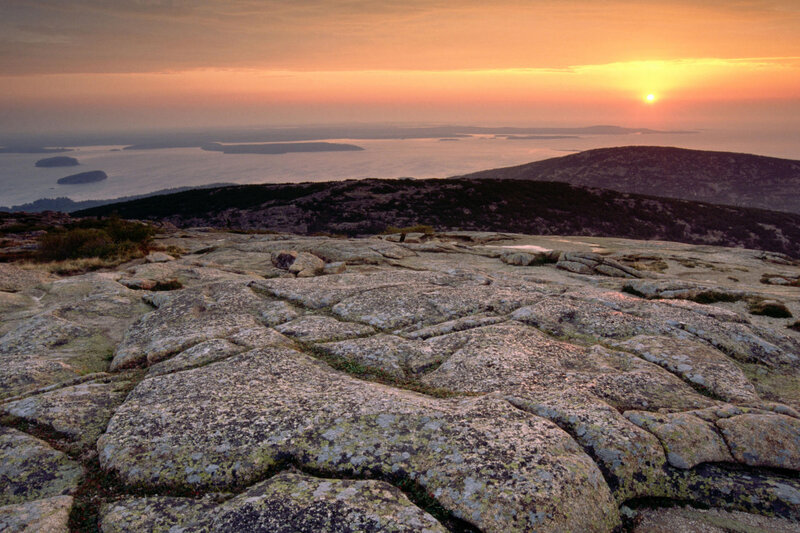Sunset over rocky coastline