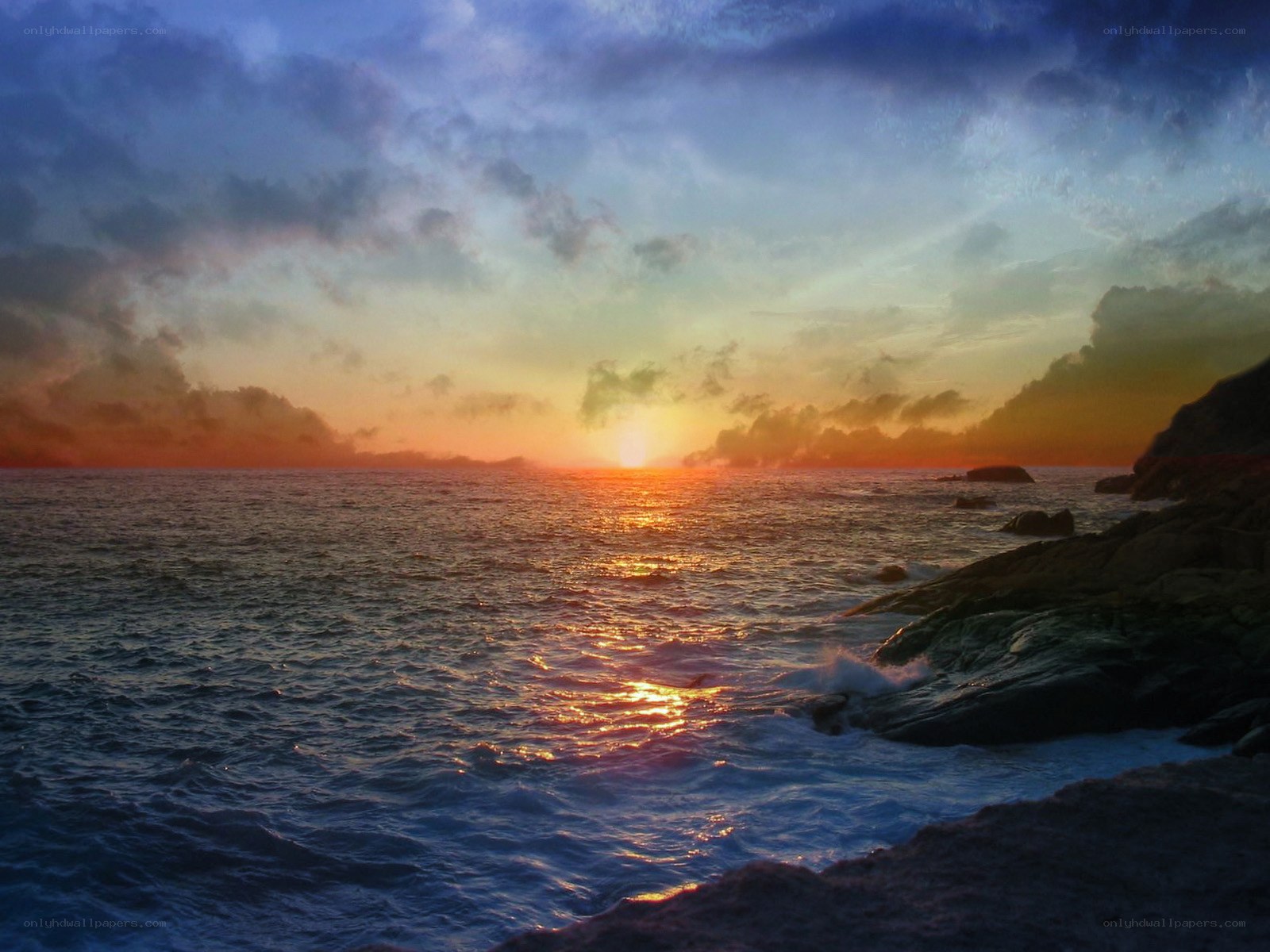 Sunset over rocky coastline