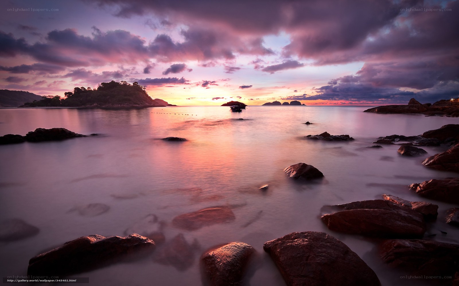 Sunset over rocky coastline