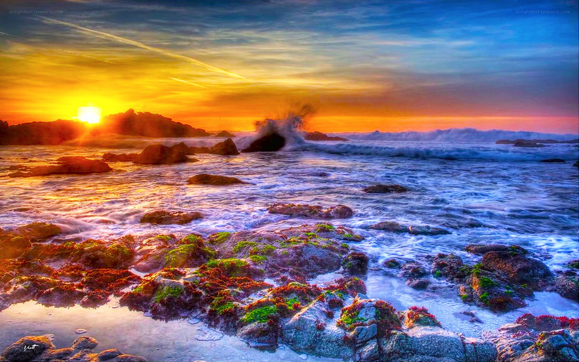 Sunset over rocky coastline