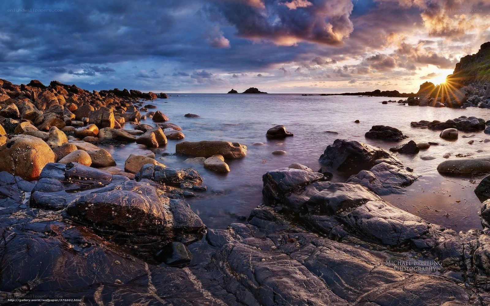 Sunset over rocky coastline