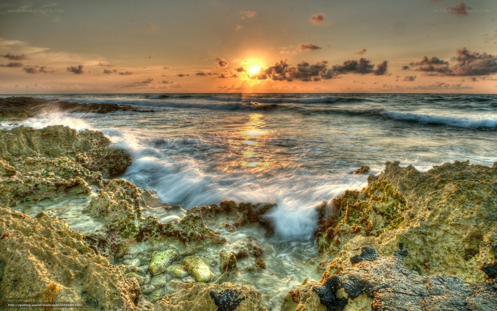 Sunset over rocky coastline