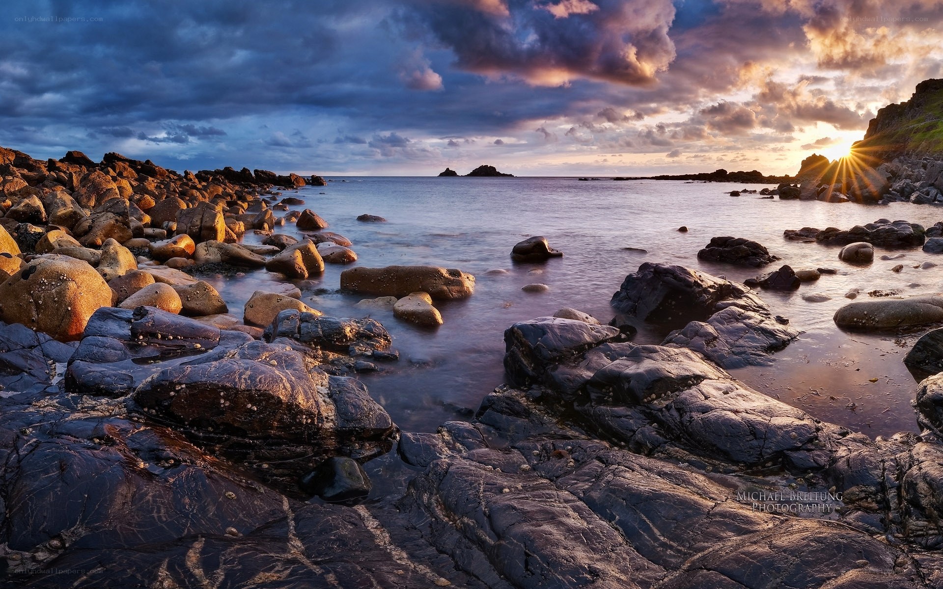 Sunset over rocky coastline