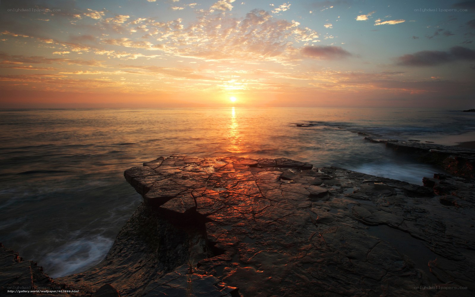 Sunset over rocky coastline