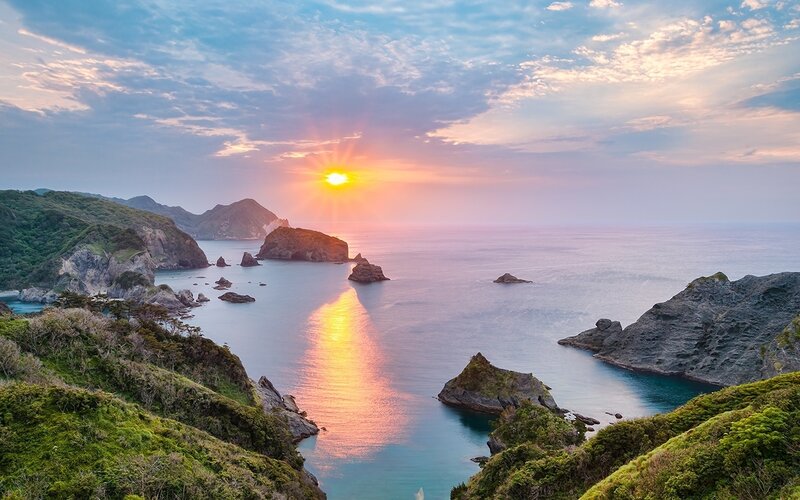 Sunset over Rocky Coastline — Blue, Serene, Photograph