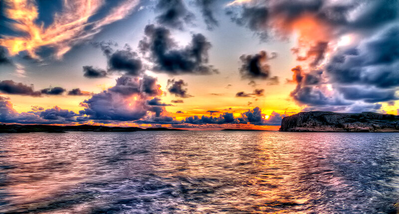 Sunset over Rocky Coastline — Orange, Dramatic, Photograph