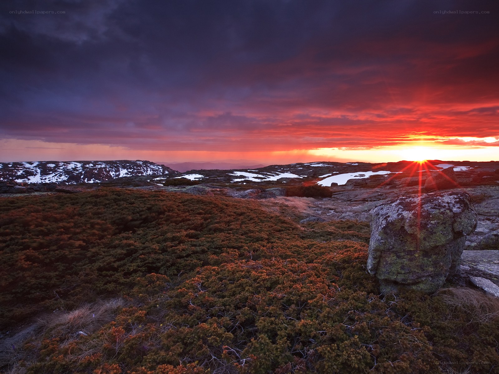 Sunset over rocky hills