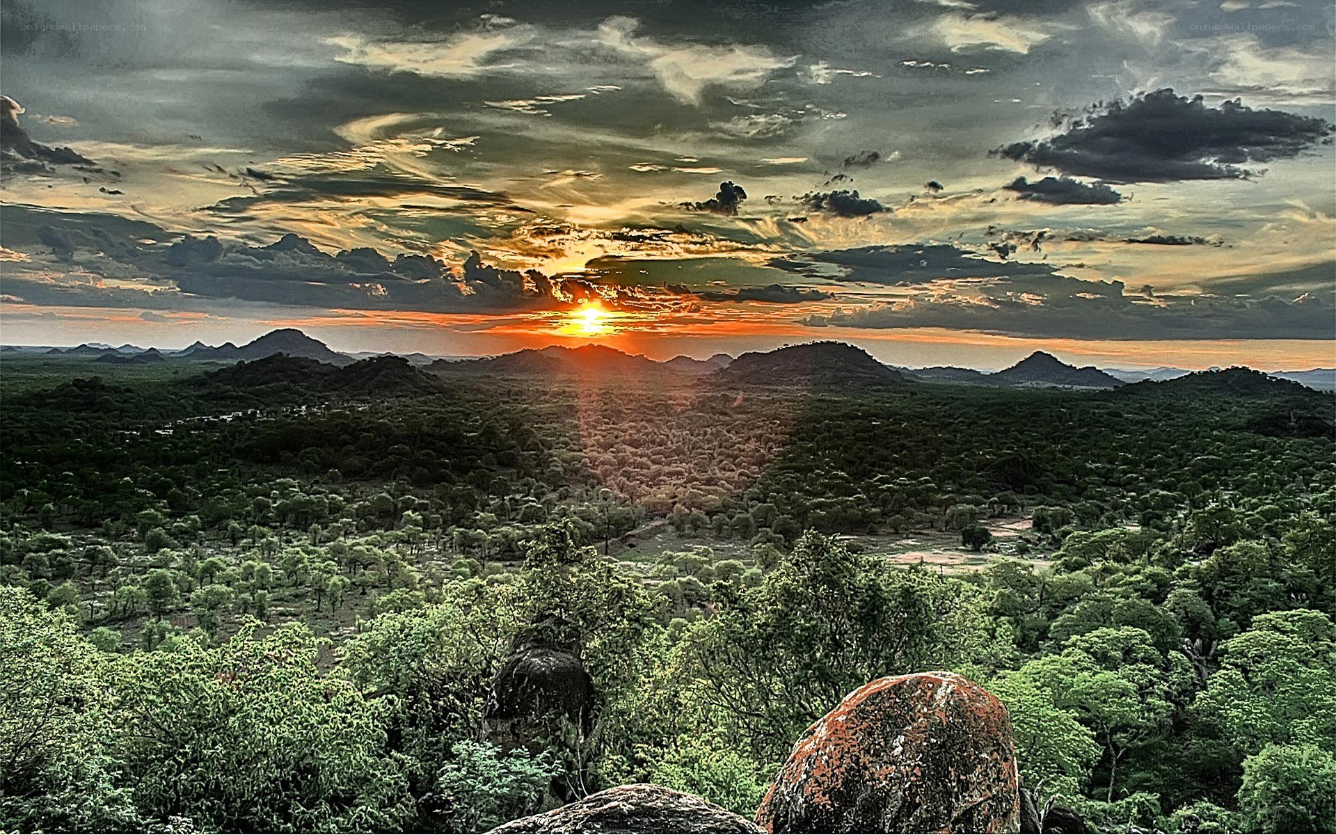 Sunset over rocky hills