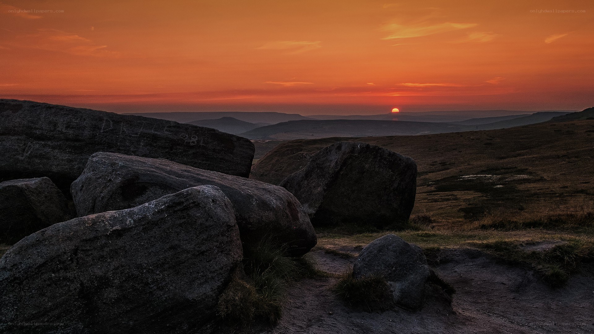 Sunset over rocky hills