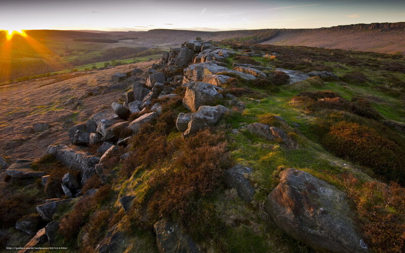 Sunset over rocky hillside